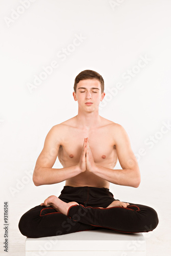 Young man meditating isolated on white background. man doing yog