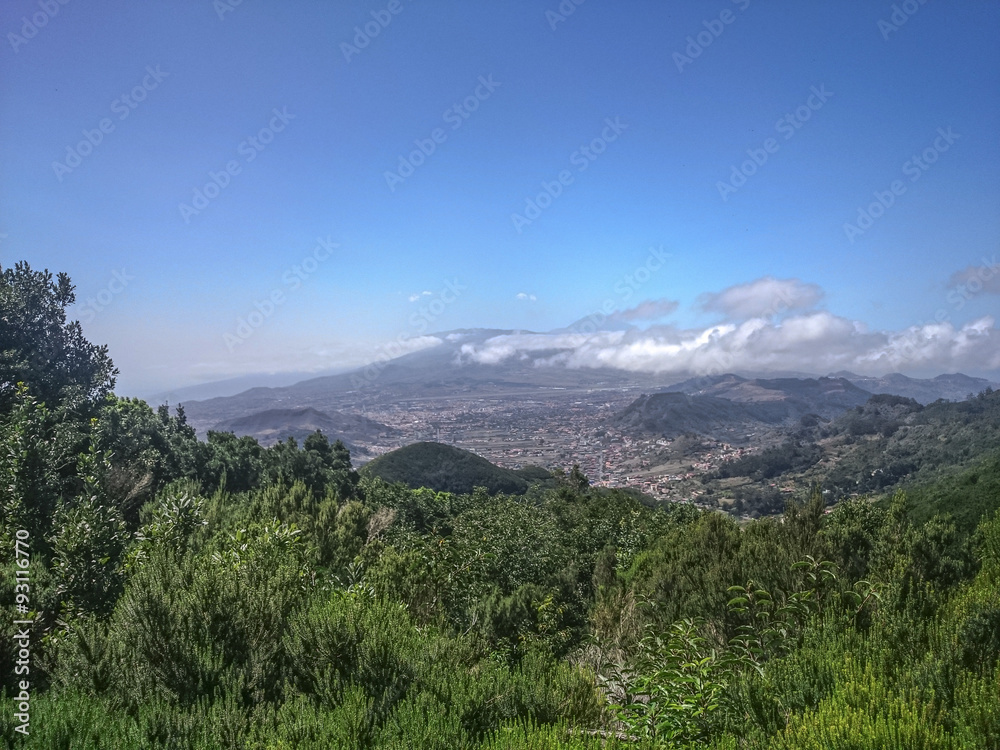 Tenerife North landscape. View from Anaga mountains on La Laguna and vulcano Teide covered in clouds.