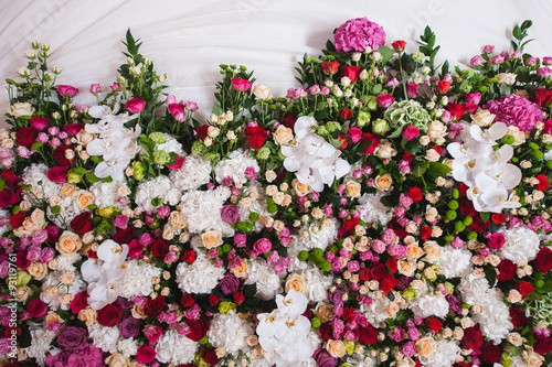 Pattern of fresh colorful roses and orchids