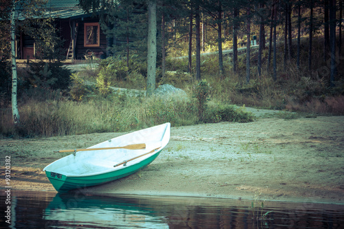 Bild auf Leinwand Old boat on beach, lake, forest, Finland