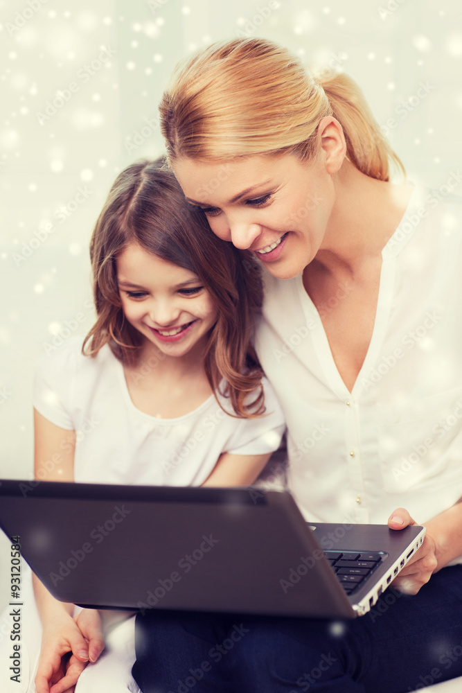 smiling mother and little girl with laptop at home smiling mother and little girl with laptop at home