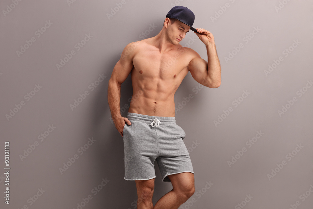 Handsome shirtless man with a blue cap Handsome shirtless man with a blue cap