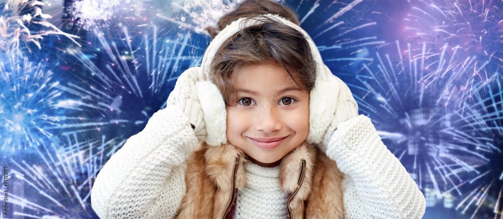 happy little girl wearing earmuffs over firework Stock Photo | Adobe Stock