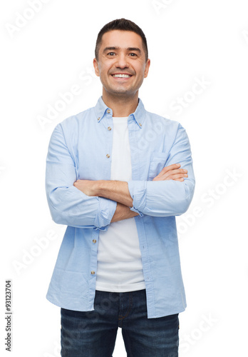 smiling man with crossed arms