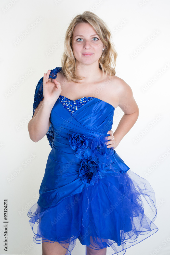 Gorgeous young blond woman with a beautiful blue dress