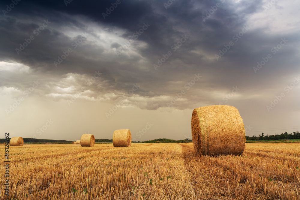 Straw bales with dramatic sky