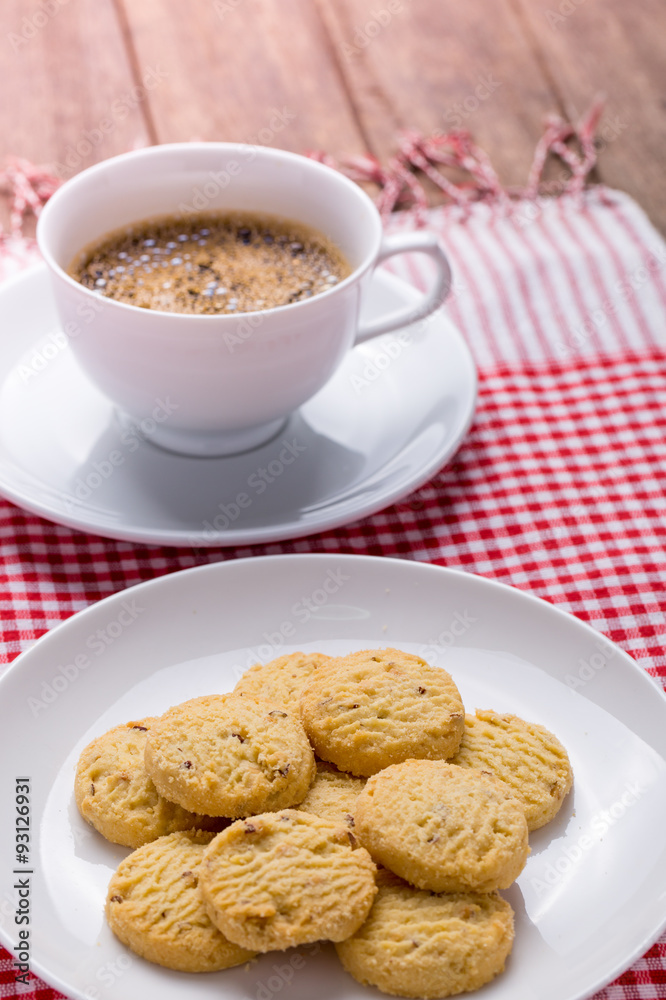 cookies on white plate and cup of coffee cookies on white plate and cup of coffee