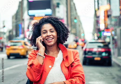 american woman making a phone call in Time Square, New york. urban lifestyle concept