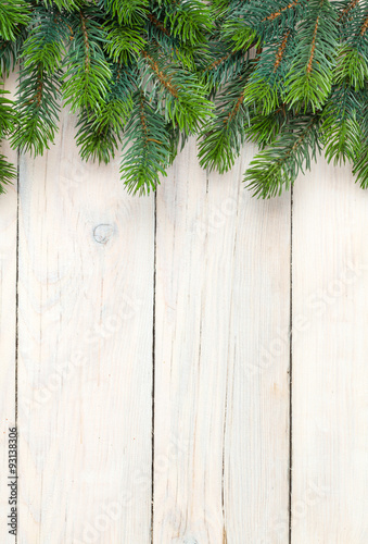 Christmas wooden background with fir tree © karandaev