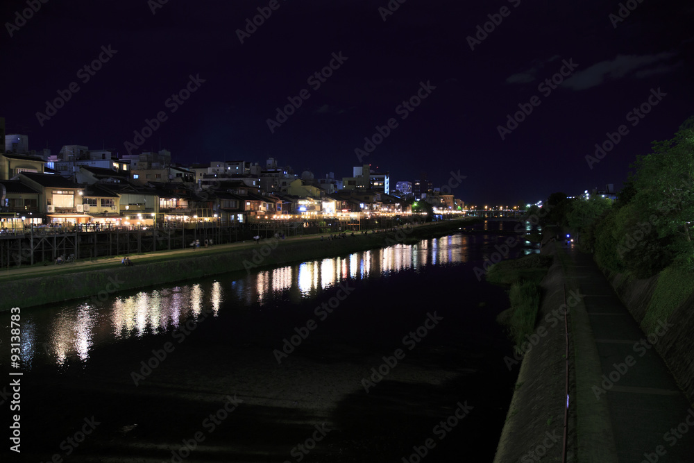 The Kamogawa River in Kyoto, Japan is popular walking spots for tourists. In summer, restaurants open balconies looking out to the river.