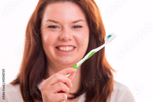 Wallpaper Mural Smiling woman holding a toothbrush Torontodigital.ca