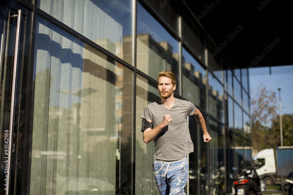 Young man running in the urban area Young man running in the urban area