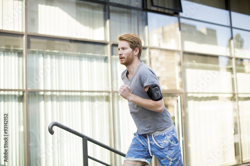 Young man running in the urban area Free Download Young man running in the urban area - GFXLoad
