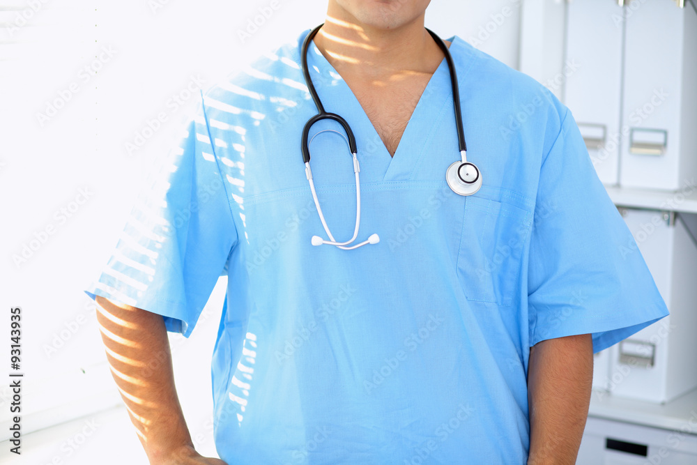 Portrait of unknown male surgeon doctor holding his stethoscope Portrait of unknown male surgeon doctor holding his stethoscope