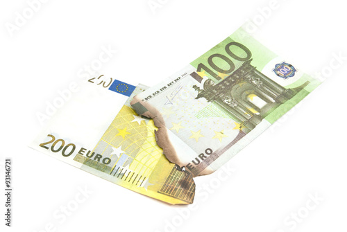 burnt euros banknotes on white
