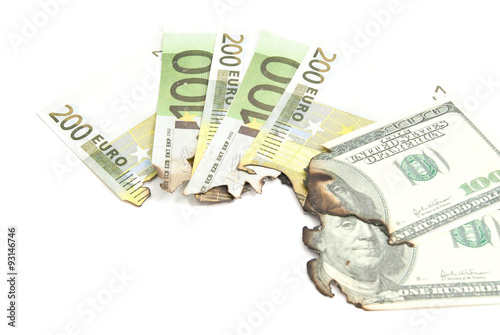 some burnt bills of euro and dollar