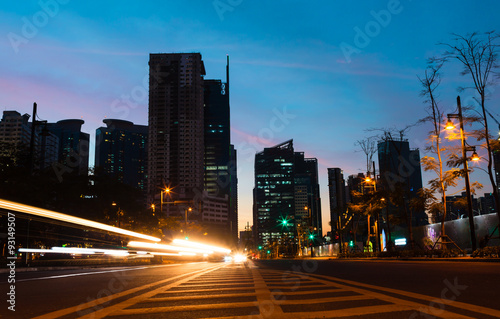 Light trails on the street at dusk in Manila, Philippines