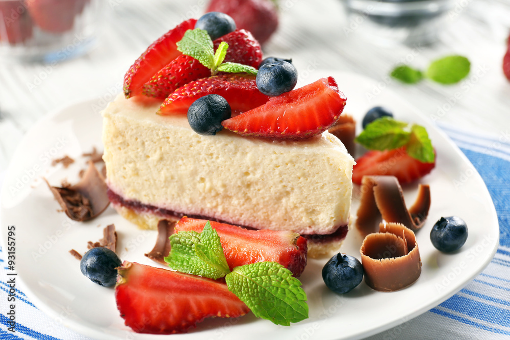 Delicious cheesecake with berries on table close up Delicious cheesecake with berries on table close up