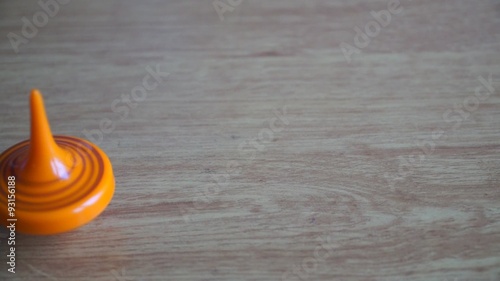 orange pinwheel spinning on a table photo