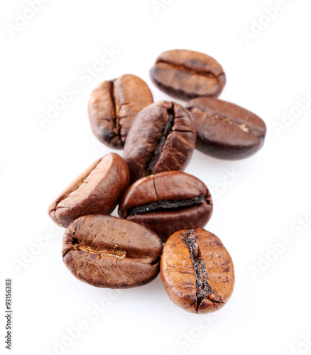 Brown coffee beans isolated on white