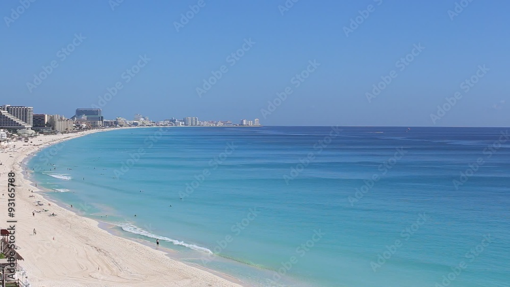 Caribbean sea beach with turquoise water and white sand. Seaside resorts along the coastline. Vacation concept Caribbean sea beach with turquoise water and white sand. Seaside resorts along the coastline. Vacation concept