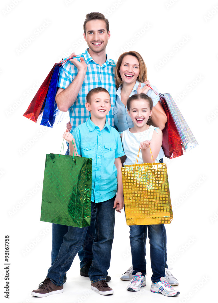 Happy american family with children holding shopping bags Happy american family with children holding shopping bags