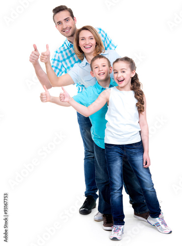 happy european family with children shows the thumbs up sign