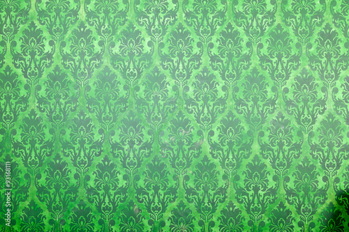 Green vintage pattern on old wall photo