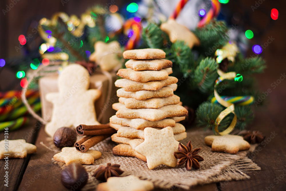 Christmas cookies and tinsel on a dark wooden background Christmas cookies and tinsel on a dark wooden background