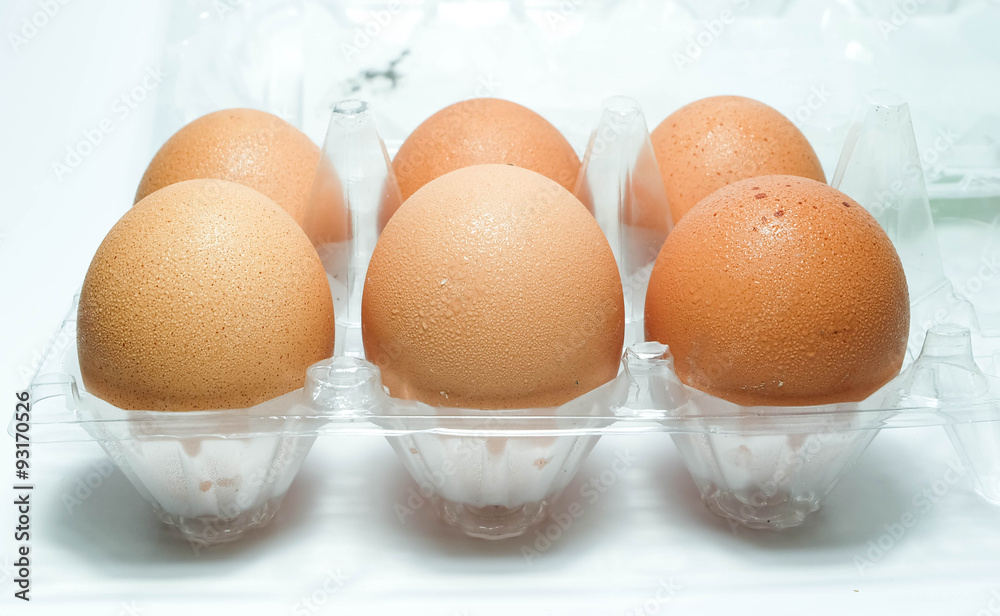 close up eggs in a plastic container close up eggs in a plastic container