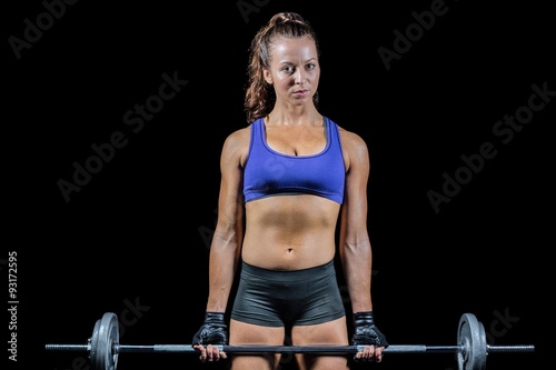 Portrait of woman exercising with crossfit