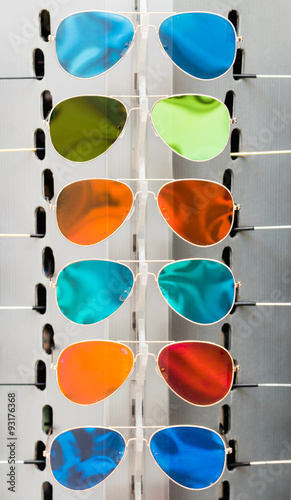 colorful sunglasses on a rack © meanmachine77
