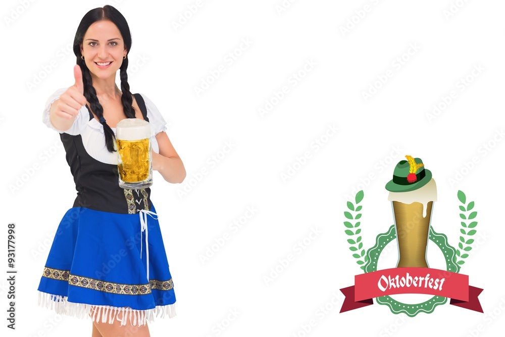 Obraz premium Composite image of pretty oktoberfest girl holding beer tankard