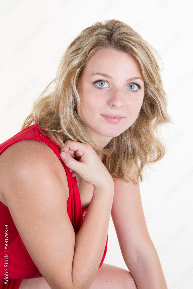 Gorgeous blond young woman with an elegant red dress Gorgeous blond young woman with an elegant red dress