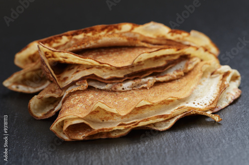 thin crepes or blinis folded in triangles