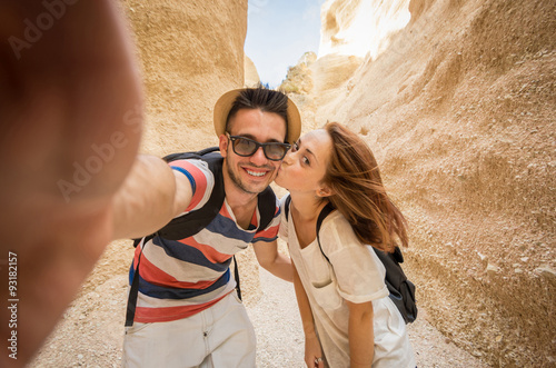 young couple laughs while doing a selfie into the grand canyon - caucasian people - people, lifestyle and nature concept photo