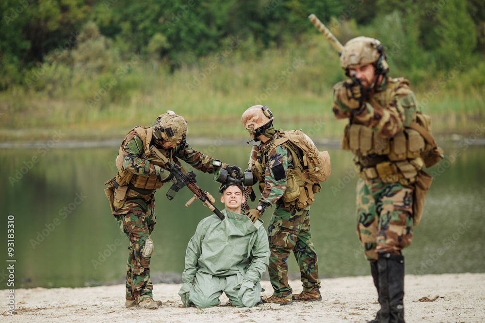 Fototapeta premium Army rangers captured a scientist with protective mask and prote