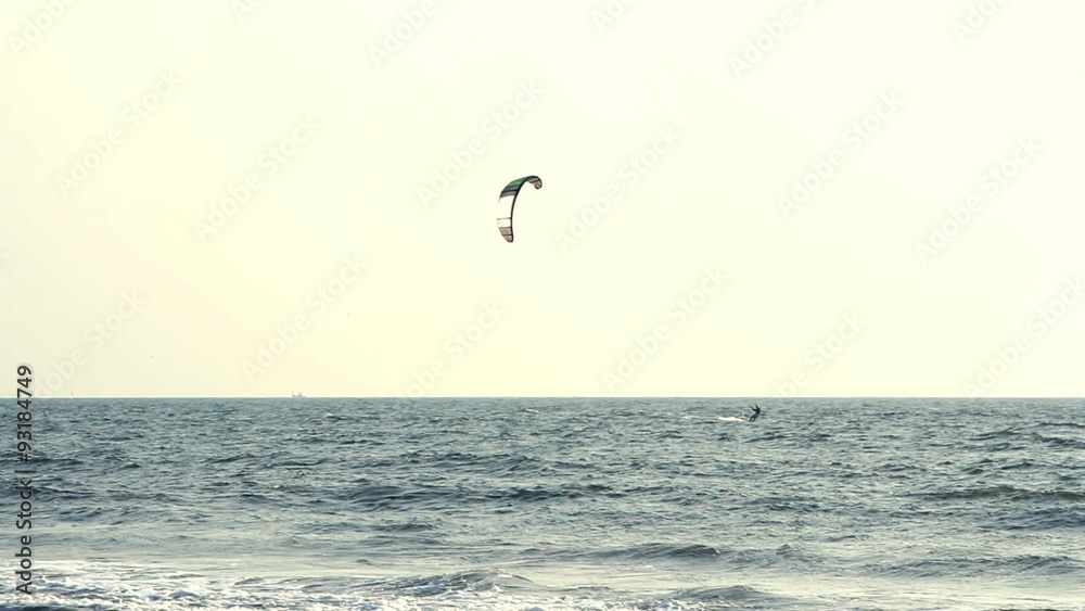 Kiteboarder enjoy surfing in the sea Kiteboarder enjoy surfing in the sea