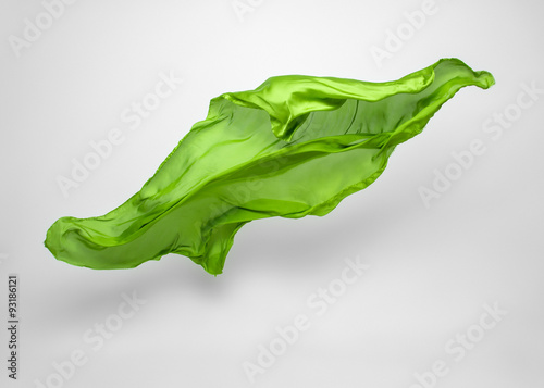 abstract piece of green fabric flying