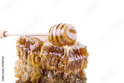 honeycomb with honey and honey stick