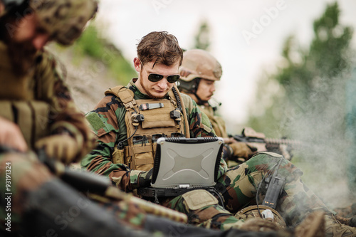 ranger using laptop outdoors