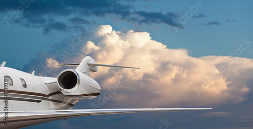 Side view of a private jet in flight