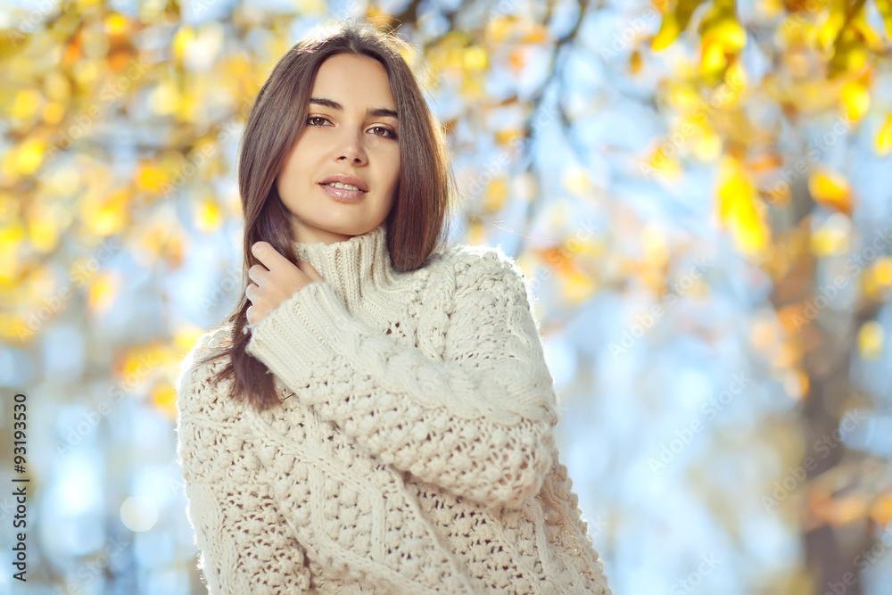 Beautiful woman in a sweater in park Beautiful woman in a sweater in park