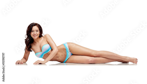 happy young woman lying in bikini swimsuit