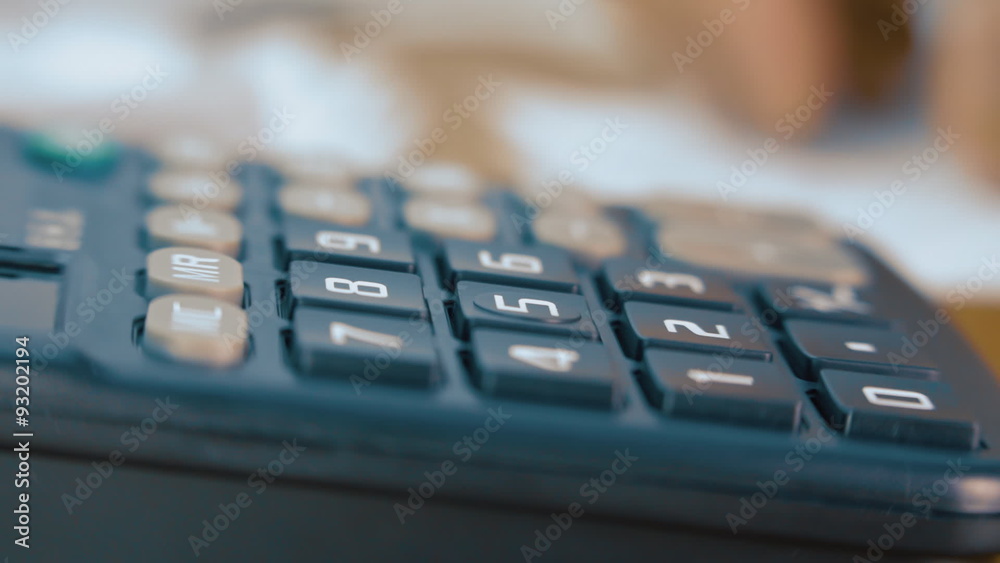 Businessman counting on the calculator. Macro Businessman counting on the calculator. Macro