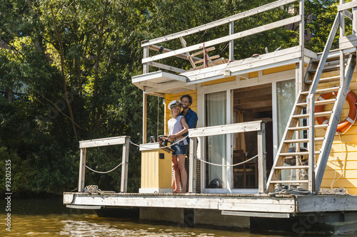 Couple having a trip on a house boat photo