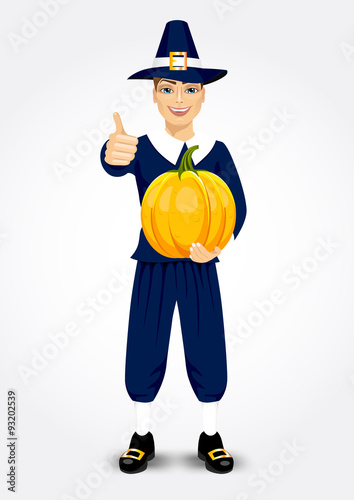 pilgrim man holding a pumpkin