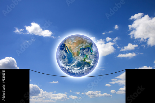 The world balancing on a rope - concept with image from NASA