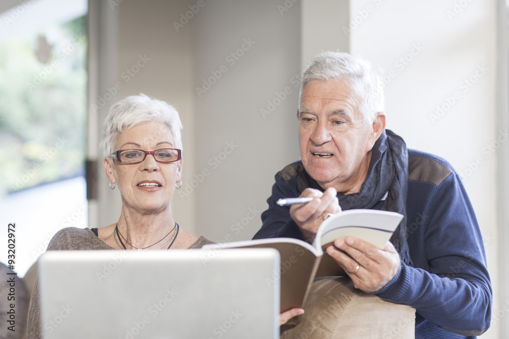 Senior couple using laptop together Senior couple using laptop together