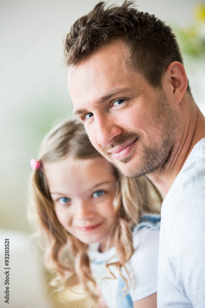 Father and daughter looking at camera, portrait Father and daughter looking at camera, portrait